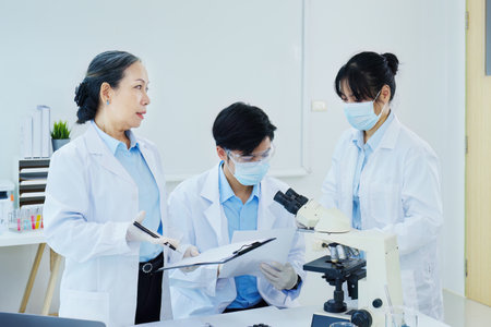 medical research laboratories, scientists analyze chemical samples Discuss technological innovations. Advanced scientific laboratories for medicine, biotechnologyの写真素材
