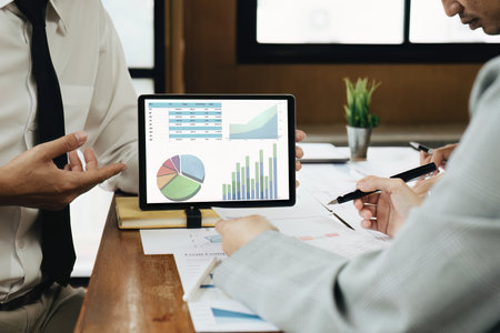 Planning to reduce investment risks, the image of a group of businesspeople working with partners is...