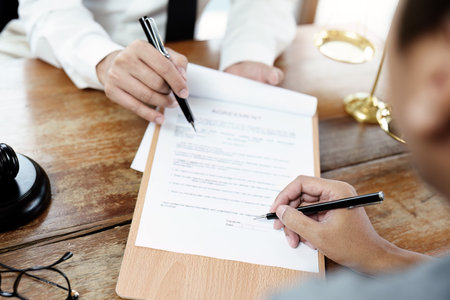 Discussing legal matters and signing important documents.
