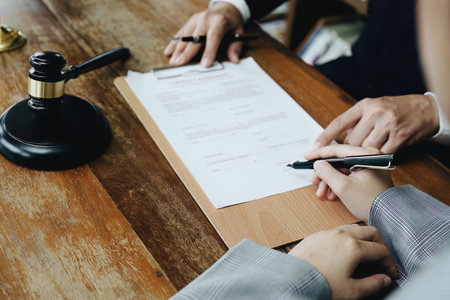 Discussing legal matters and signing important documents.
