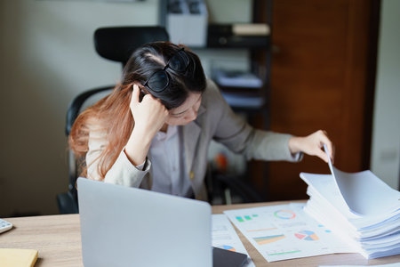 Portrait of sme business owner, man using computer and financial statements Anxious expression on...