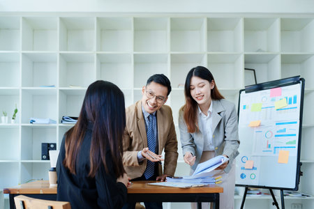 Asian entrepreneurs and business people meeting in a conference room in business planning, financial budget and investment risk assessment to analyze customer groups to increase company growth.の写真素材