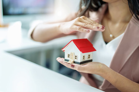 Agent, buy and sell land, property tax, show the concept of protecting the house to insure the risk of damage to the homeの写真素材