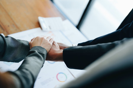 business group people showing unity with their hands together.