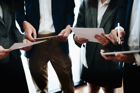 business group people are meeting and discussing budget and marketing plans in order to strategize to win over partners in order to keep the company number one.の写真素材