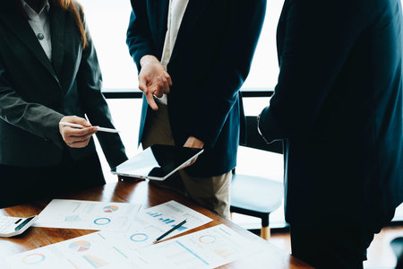 Business group people meeting and discuss to come up with conclusions on market, investment and marketing planning based on the financial budget provided by the company.の写真素材