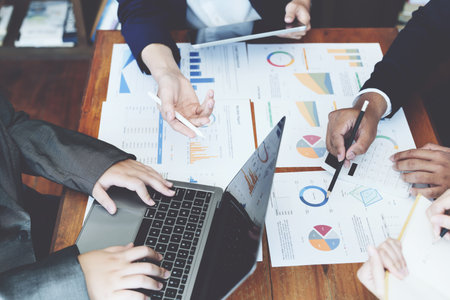 The companys businessmen meet and discuss to plan a marketing strategy and come to a conclusion on...