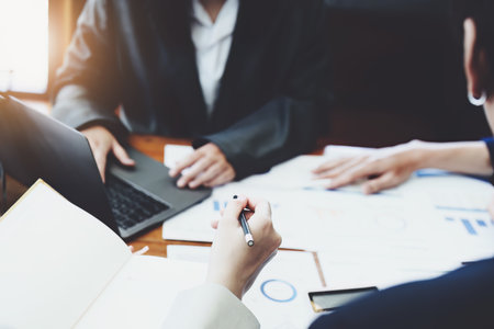 The companys businessmen meet and discuss to plan a marketing strategy and come to a conclusion on how to use the financial budget to avoid investment risks.の写真素材