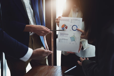business group people meeting and discuss, plan financial budgets for investments, planning new marketing strategies to fight with competitors.の写真素材