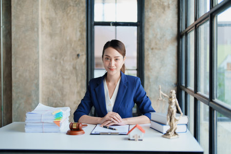 Law, Consultation, Agreement, Contract, Concept Attorney or Lawyer is sitting and accepting complaints from clients for home and land matters in courtの写真素材