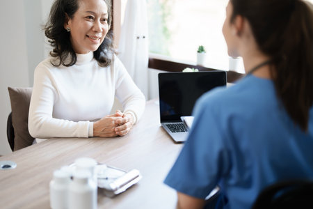 Portrait of a female doctor holding a patient clipboard to discuss and analyze the patients condition before treatingの写真素材