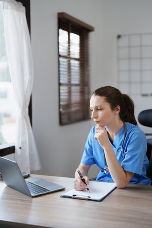Portrait of female doctor holding patient diagnosis papersの写真素材