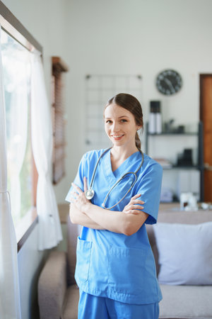 Portrait of a female doctor standing smiling ready to work in the morningの写真素材