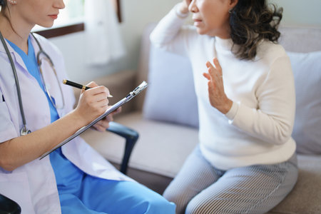 Portrait of a female doctor holding a patient clipboard to discuss and analyze the patients condition before treatingの写真素材
