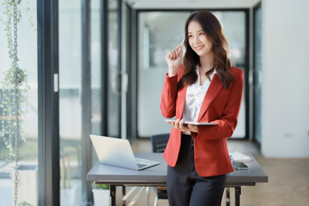 business owner or Asian female marketers are using tablet computer in office work.の写真素材
