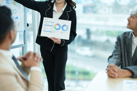 Asian entrepreneurs and business people meeting in a conference room in business planning, financial budget and investment risk assessment to analyze customer groups to increase company growth.の写真素材