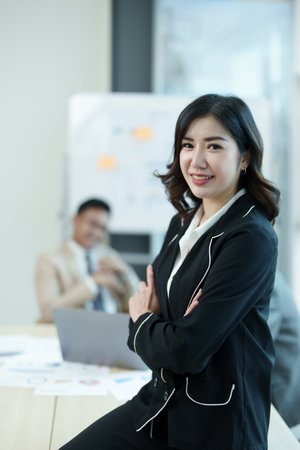 Portrait of a female business owner with a smiling face successfully invests his business in a conference room.の写真素材