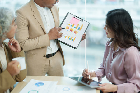 Asian entrepreneurs and business people meeting in a conference room in business planning, financial budget and investment risk assessment to analyze customer groups to increase company growth.の写真素材