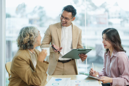 Asian entrepreneurs and business people meeting in a conference room in business planning, financial budget and investment risk assessment to analyze customer groups to increase company growth.の写真素材