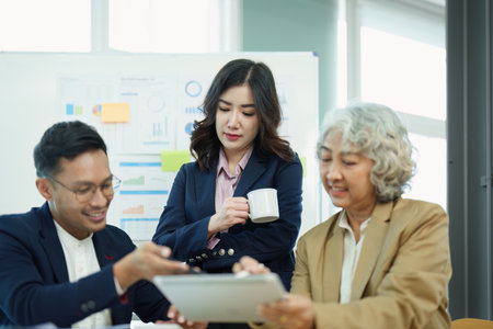Asian entrepreneurs and business people meeting in a conference room in business planning, financial budget and investment risk assessment to analyze customer groups to increase company growth.の写真素材