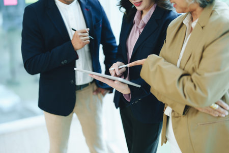Asian entrepreneurs and business people meeting in a conference room in business planning, financial budget and investment risk assessment to analyze customer groups to increase company growth.の写真素材
