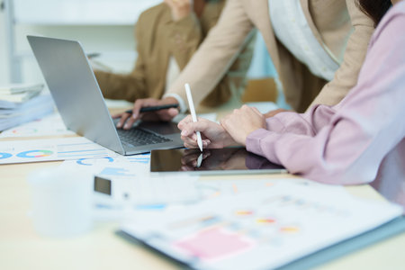 Asian entrepreneurs and business people meeting in a conference room in business planning, financial budget and investment risk assessment to analyze customer groups to increase company growth.の写真素材