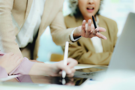 Asian entrepreneurs and business people meeting in a conference room in business planning, financial budget and investment risk assessment to analyze customer groups to increase company growth.の写真素材