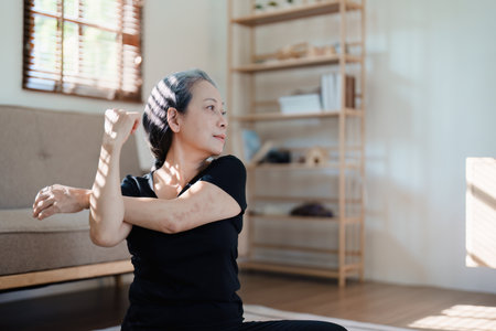 stress relief, muscle relaxation, breathing exercises, exercise, meditation, portrait of Young Asian woman relaxing her body from by practicing yogaの写真素材