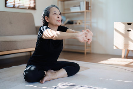 stress relief, muscle relaxation, breathing exercises, exercise, meditation, portrait of Young Asian woman relaxing her body from by practicing yogaの写真素材