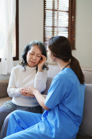 Portrait of a female doctor holding a patients hand to encourage the fight against diseaseの写真素材