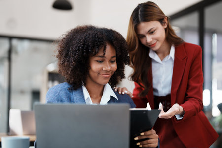 Multiethnic business, Beautiful American African with asian businesswomans people in meeting. Accountant people do document, tax, exchange, accounting and Financial advisor.の写真素材