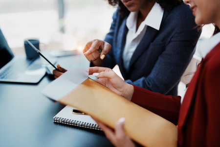 Multiethnic business, Beautiful American African with asian businesswomans people in meeting. Accountant people do document, tax, exchange, accounting and Financial advisor.の写真素材