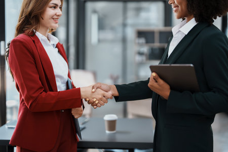Multi ethnic business Financial shaking hands, Successful businessmen handshaking after good deal. Business Finishing up meeting contract concept.の写真素材