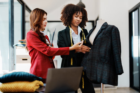 Multi ethnic young teen african american and asian woman fashion designer stylish and friend working at fashion Business studio.の写真素材