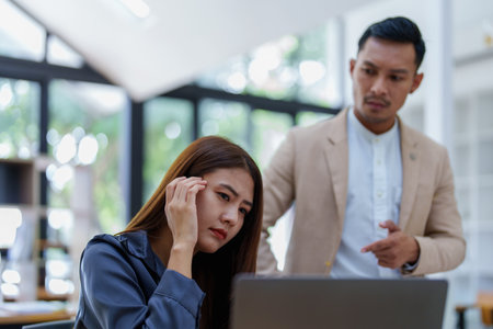 portrait of a female marketing worker showing a worried expression after being reprimanded by a male...
