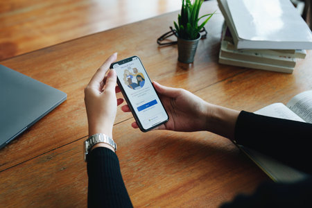 CHIANG MAI, THAILAND - Jun29, 2022 : A working from home employee is downloading the Microsoft Teams social platform, ready for remote working in isolation from home.のeditorial素材