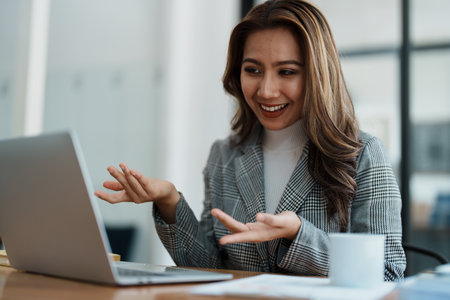 Business work and planning, portrait of a businesswoman using a computer in a meeting.の写真素材
