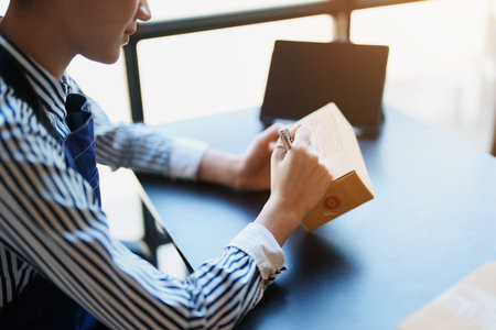 Starting small business entrepreneur of independent Asian female online seller packing products to send to customers and SME delivery concept.の写真素材