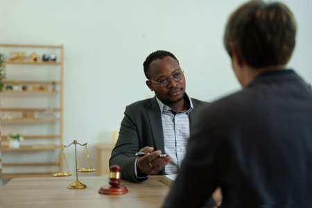 african american attorney, lawyers discussing contract or business agreement at law firm office, Business people making deal document legal, justice advice service concepts.の写真素材