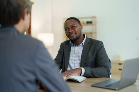 african american attorney, lawyers discussing contract or business agreement at law firm office, Business people making deal document legal, justice advice service concepts.の写真素材
