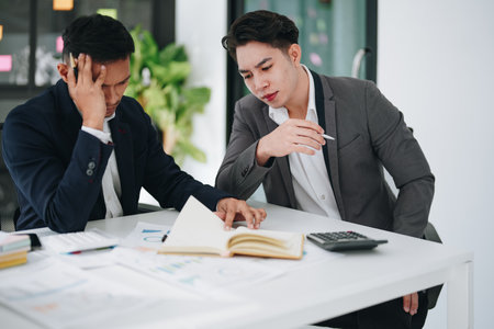 Burnout, stress and business man overworked from too much, work overload and pressure marketing corporate company. Time management, frustrated and tired employeeの写真素材