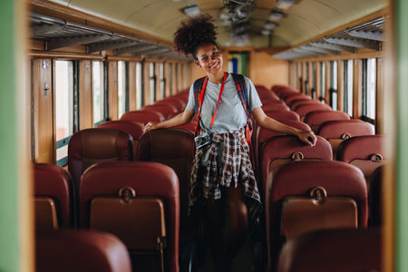 Tourists african american are showing happy expressions while waiting for their journey in the train stationの写真素材