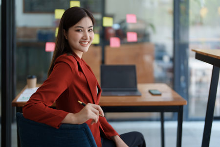 Business, finance and employment, female successful entrepreneurs concept. Confident smiling asian businesswoman, using laptop at workの写真素材