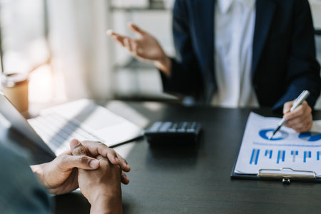 startup business, business advisor leadership for planning finance investment teamwork paperwork audit and discussing marketing, profit, budget of company in meeting roomの写真素材
