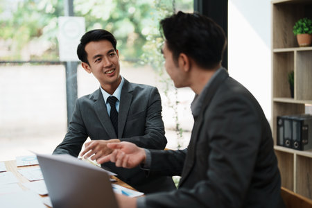startup Asian business advisor meeting to analyze and discuss the situation on the financial report in the meeting room.Investment Consultant, Financialの写真素材