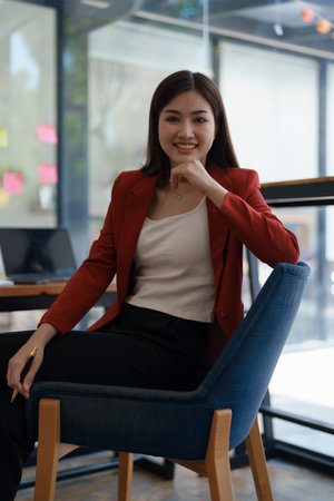 Portrait of a woman business owner showing a happy smiling face as he has successfullyの写真素材