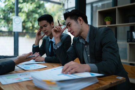 Burnout, stress and business man overworked from too much, work overload and pressure marketing corporate company. Time management, frustrated and tired employeeの写真素材