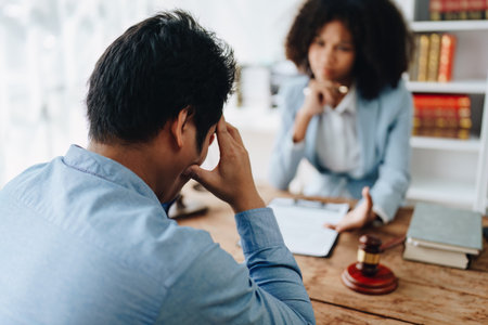 african american attorney, lawyers discussing contract or business agreement at law firm office, Business people making deal document legal, justice advice service concepts.の写真素材