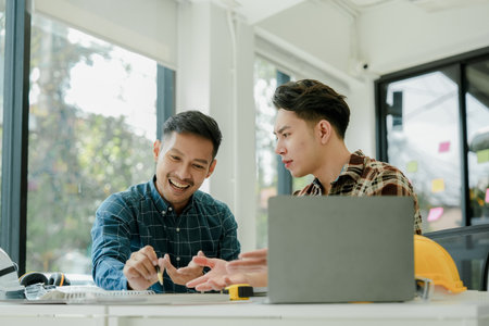 Engineers, designers and interior designers are finalizing the design of interiors by discussing selecting materials and colors to design rooms to present to clientsの写真素材