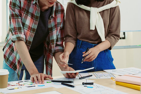 Group of asian creative team programing designers participate in all phases of the UX UI designの写真素材